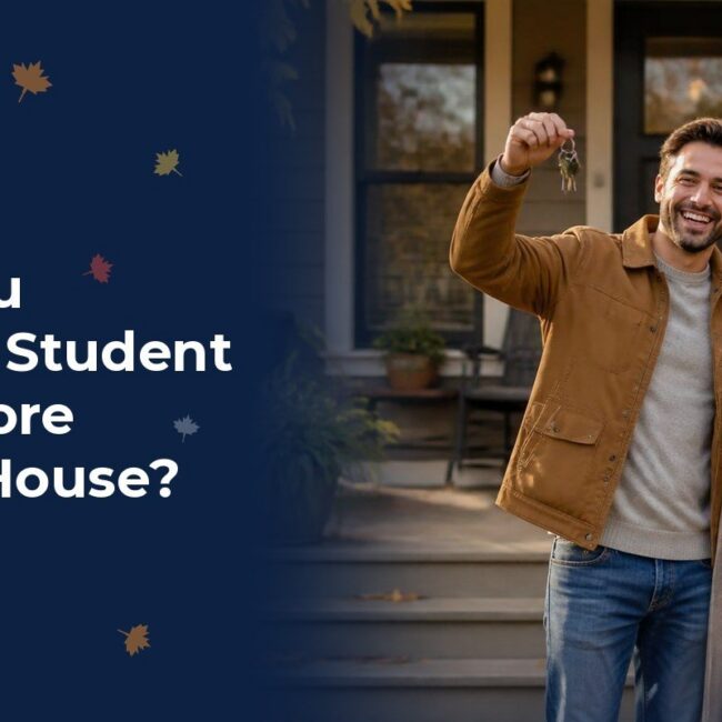 A young couple on the front steps of their new home in autumn holding up the keys after planning their student loans around a mortgage