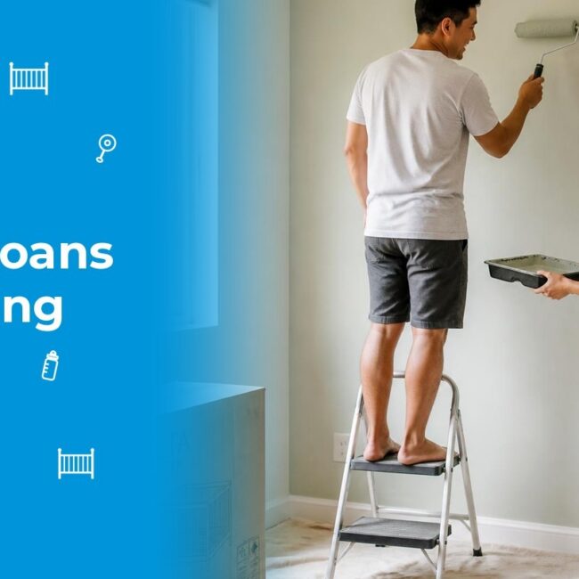 A young couple laughing while painting their babys nursery with more room in their budget after refinancing student loans